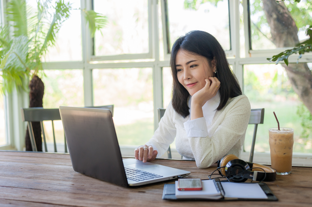 digital marketing professional working on her laptop