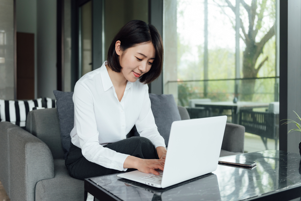 a professional working on her laptop