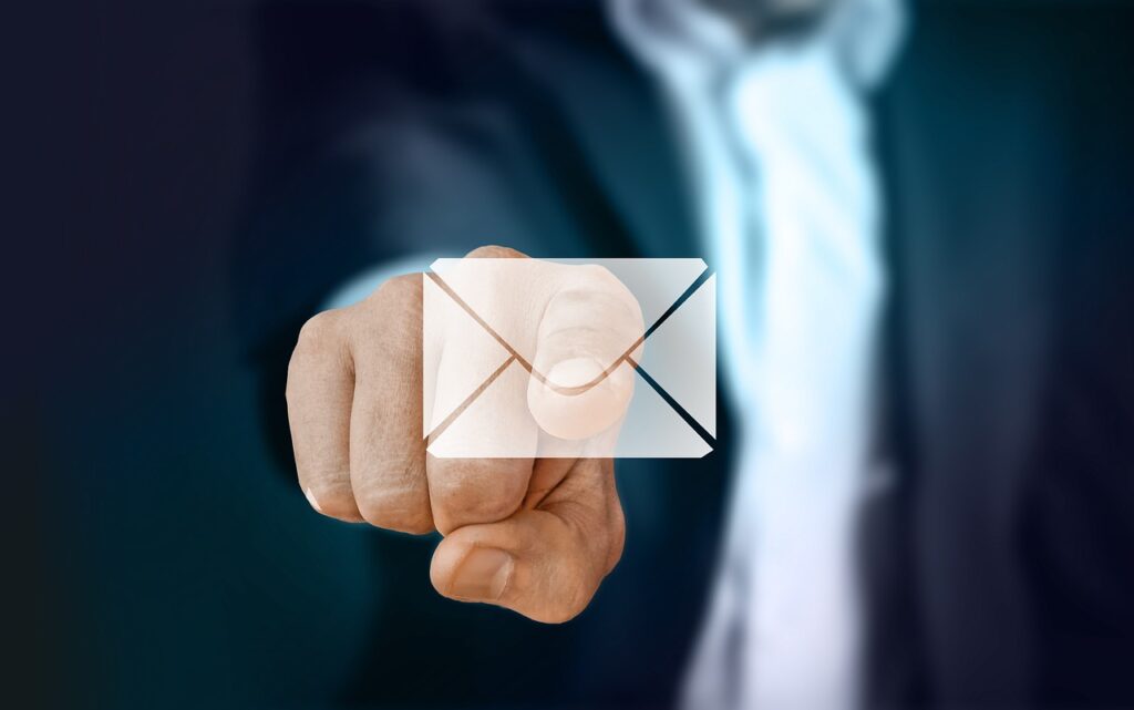 finger pointing to a mail icon