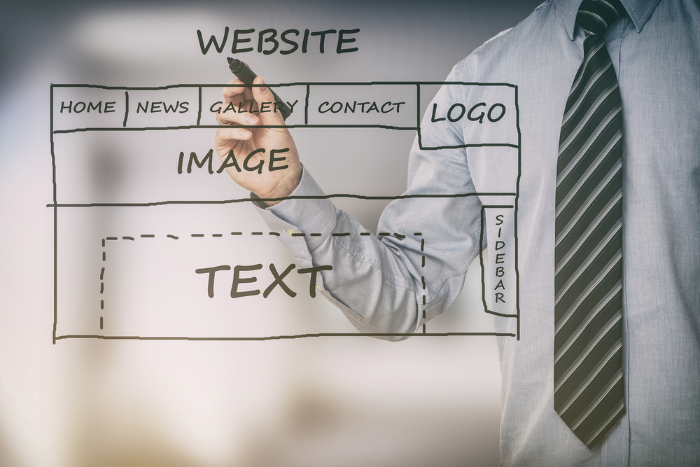 man drawing a website structure