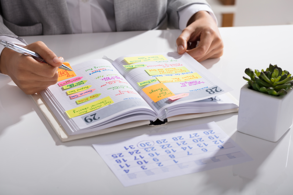 woman writing contents and creating calendar agenda