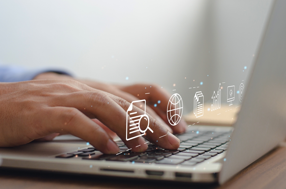 Close Up Image Of Hands Typing On Laptop With Content And Digital Marketing Hologram Icons