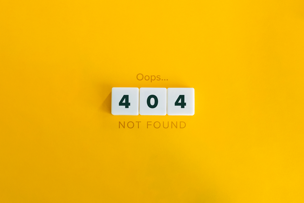 404 error page not found wooden blocks on yellow background