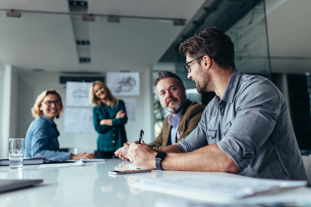 Group of people in a board meeting at office