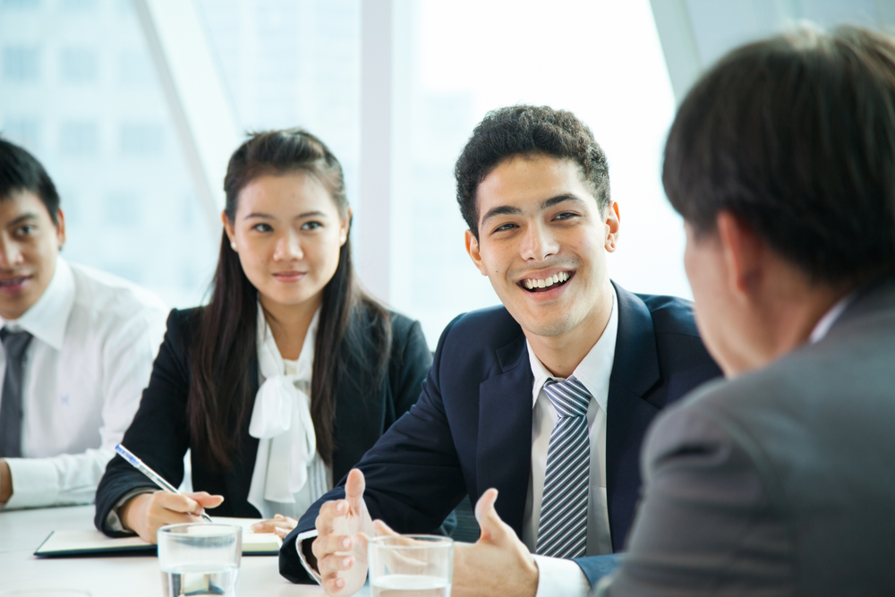 four corporate employees having a meeting